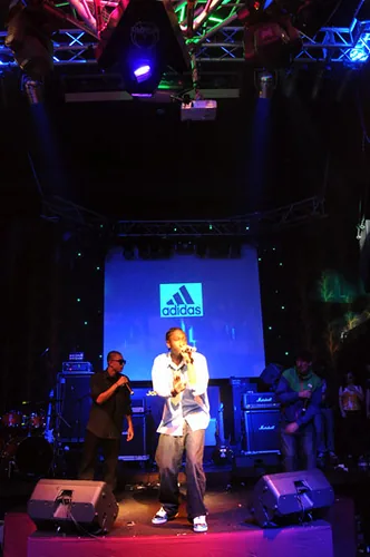 KING STUNNA performing onstage in front of an Adidas display